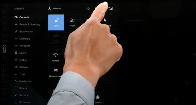 a finger press control setting button on tesla model s