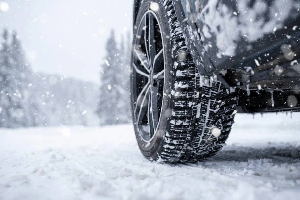 car tires on a snowy road