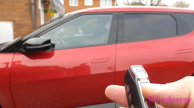 red kia ev6 with car key