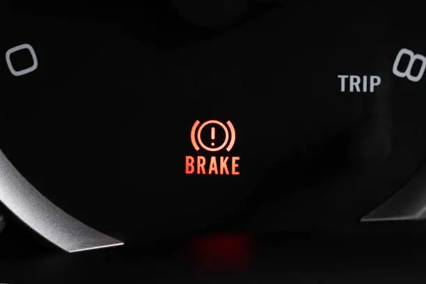 Brake light signal icon on the car panel, Photo close-up.